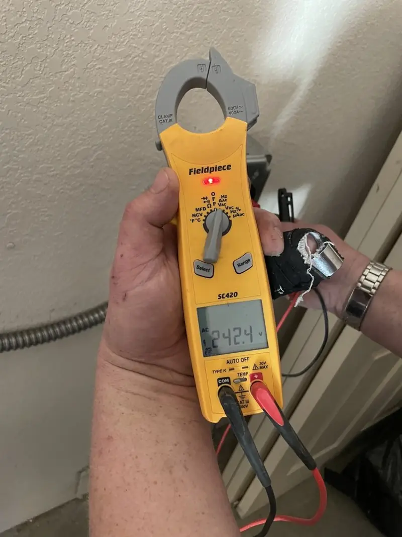 Voltage testing with clamp meter during Generator Installation in Home Gardens